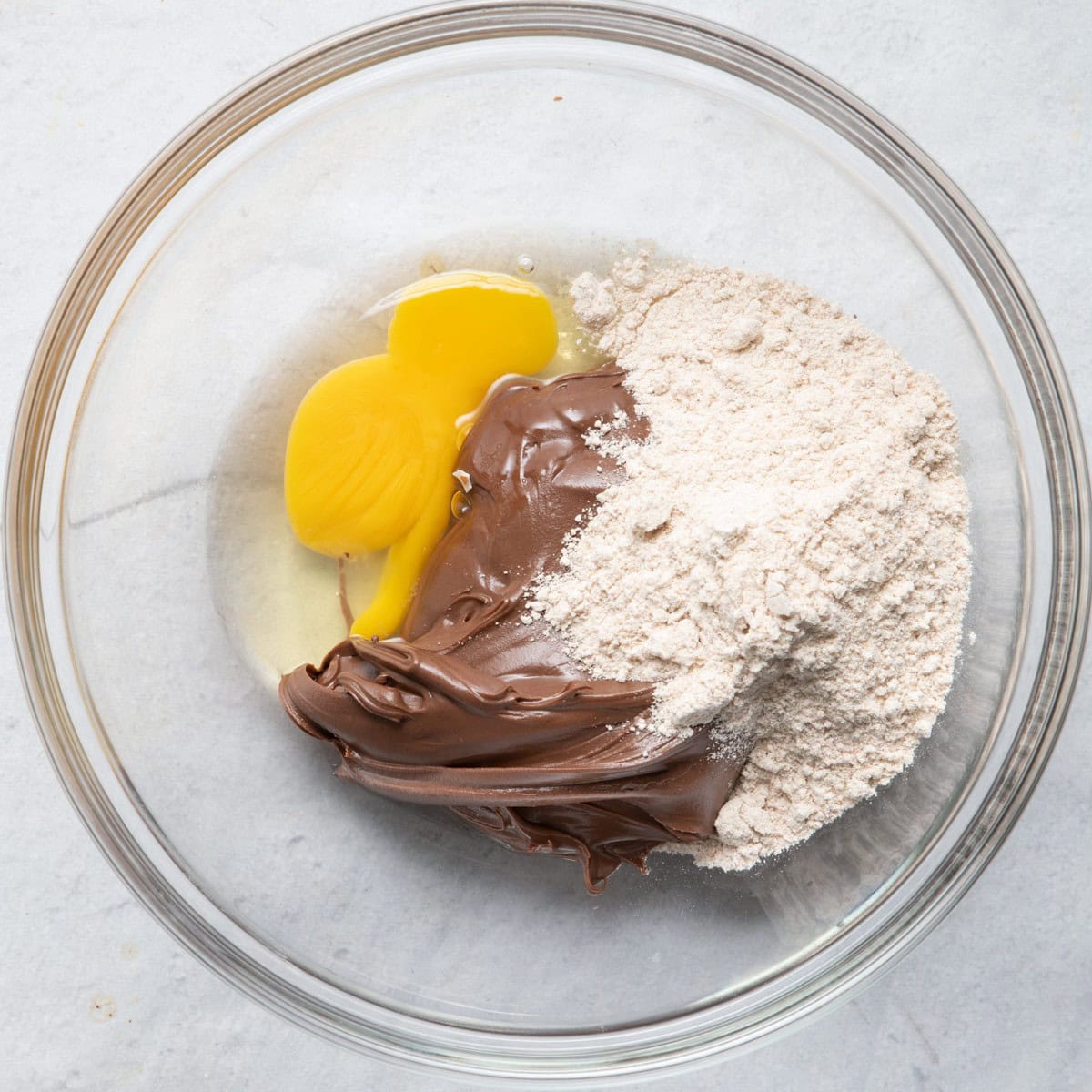 Hazelnut spread, egg and flour before mixing.