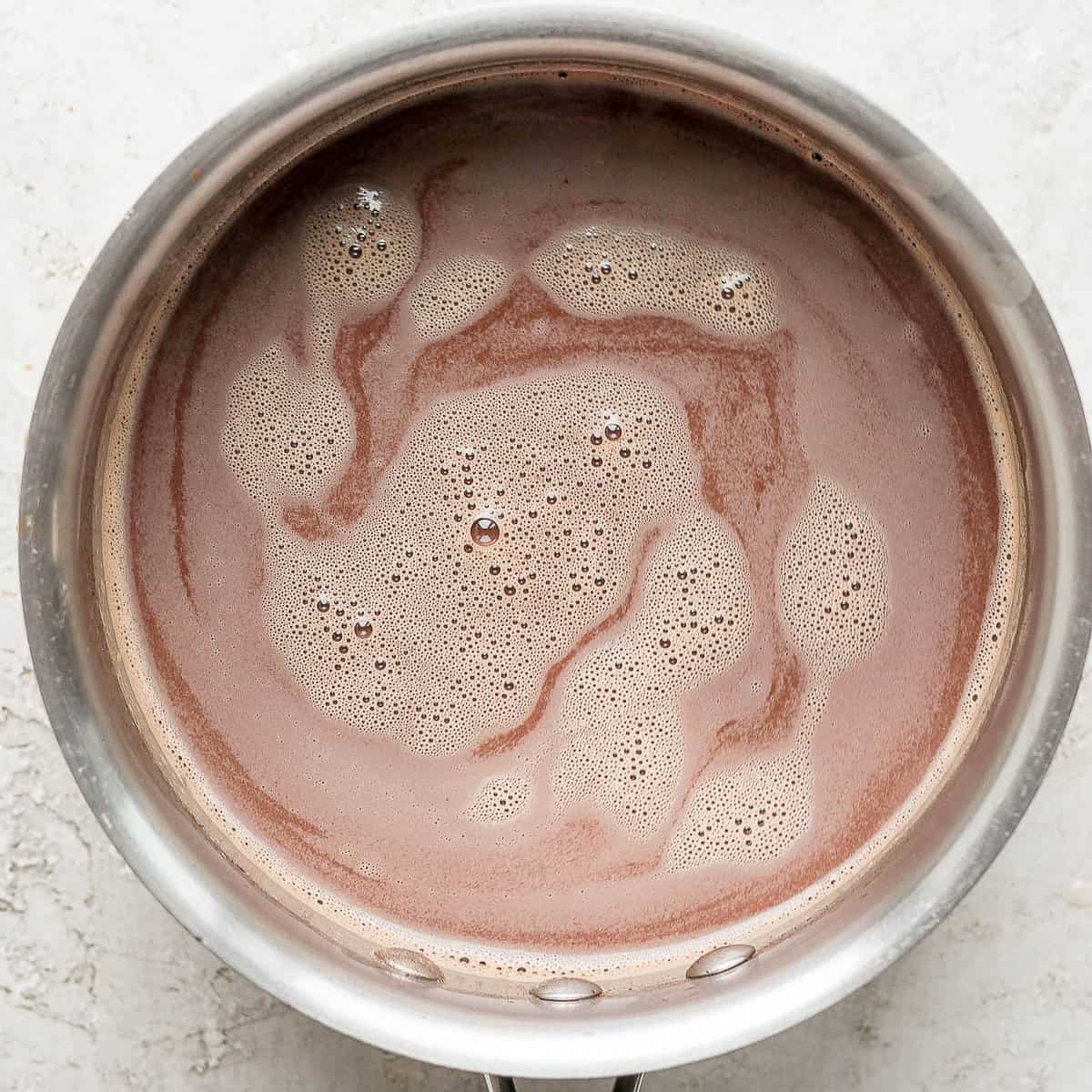 Whisking final product in the saucepan.