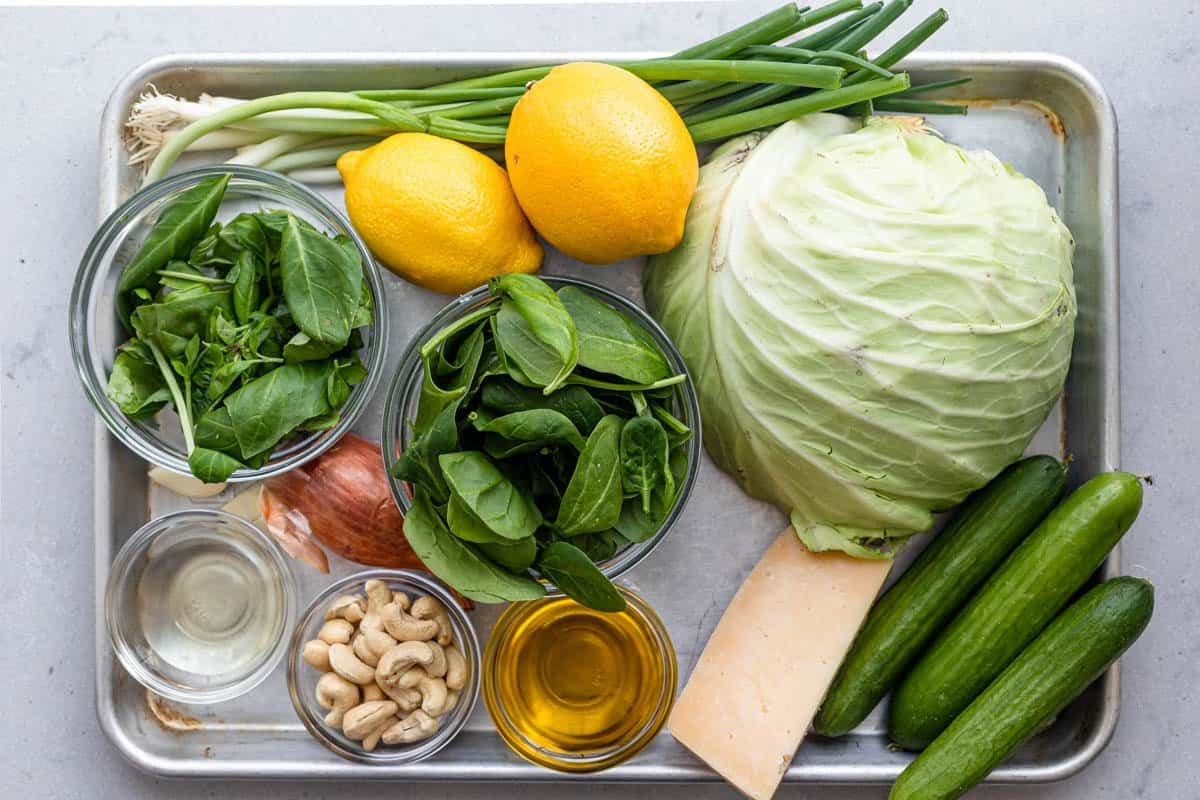 Ingredients to make the green goddess salad on a tray