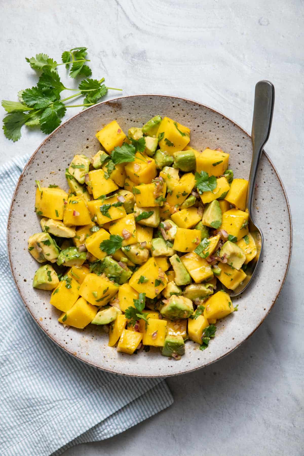 Mango avocado salad tossed with an easy vinaigrette