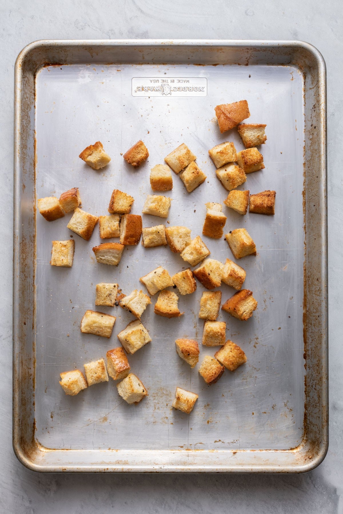 Croutons after baked on baking sheet.