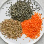 Plate showing three types of lentils: brown, red and green