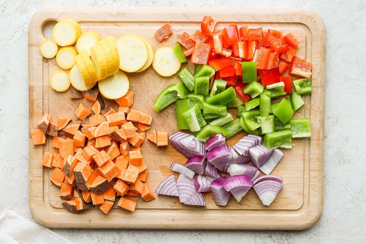 Vegetables chopped on cutting board before roasting