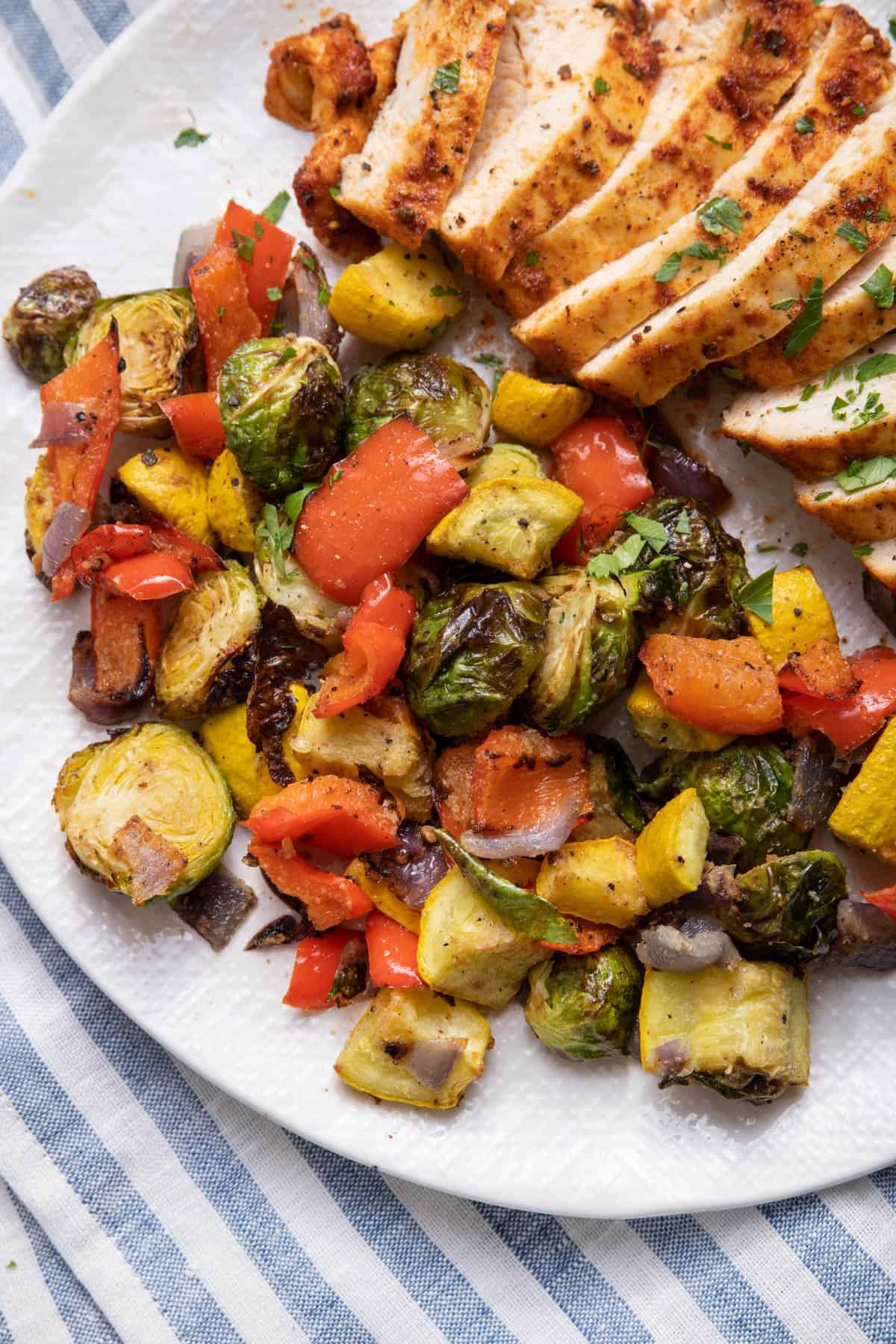 Air fryer vegetables served with chicken