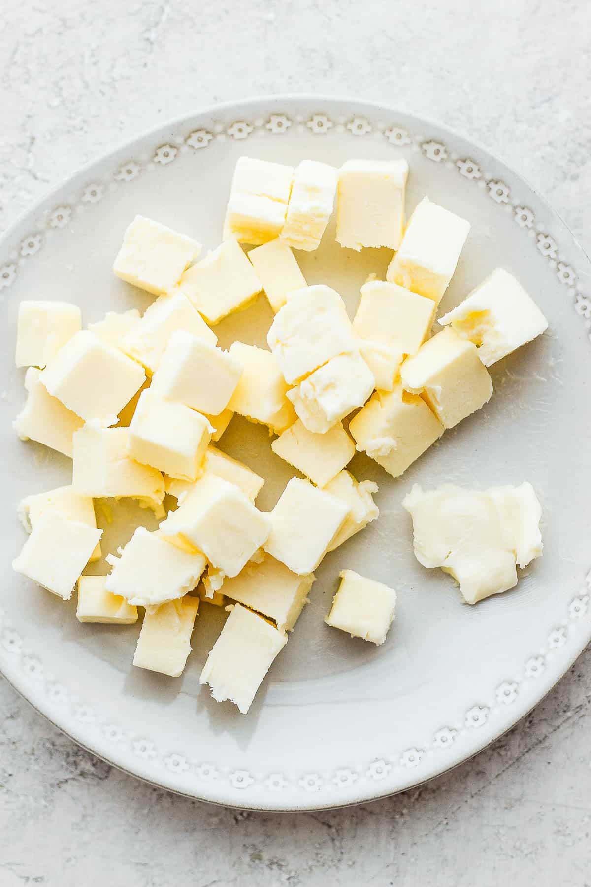 Cubed butter softened on a plate