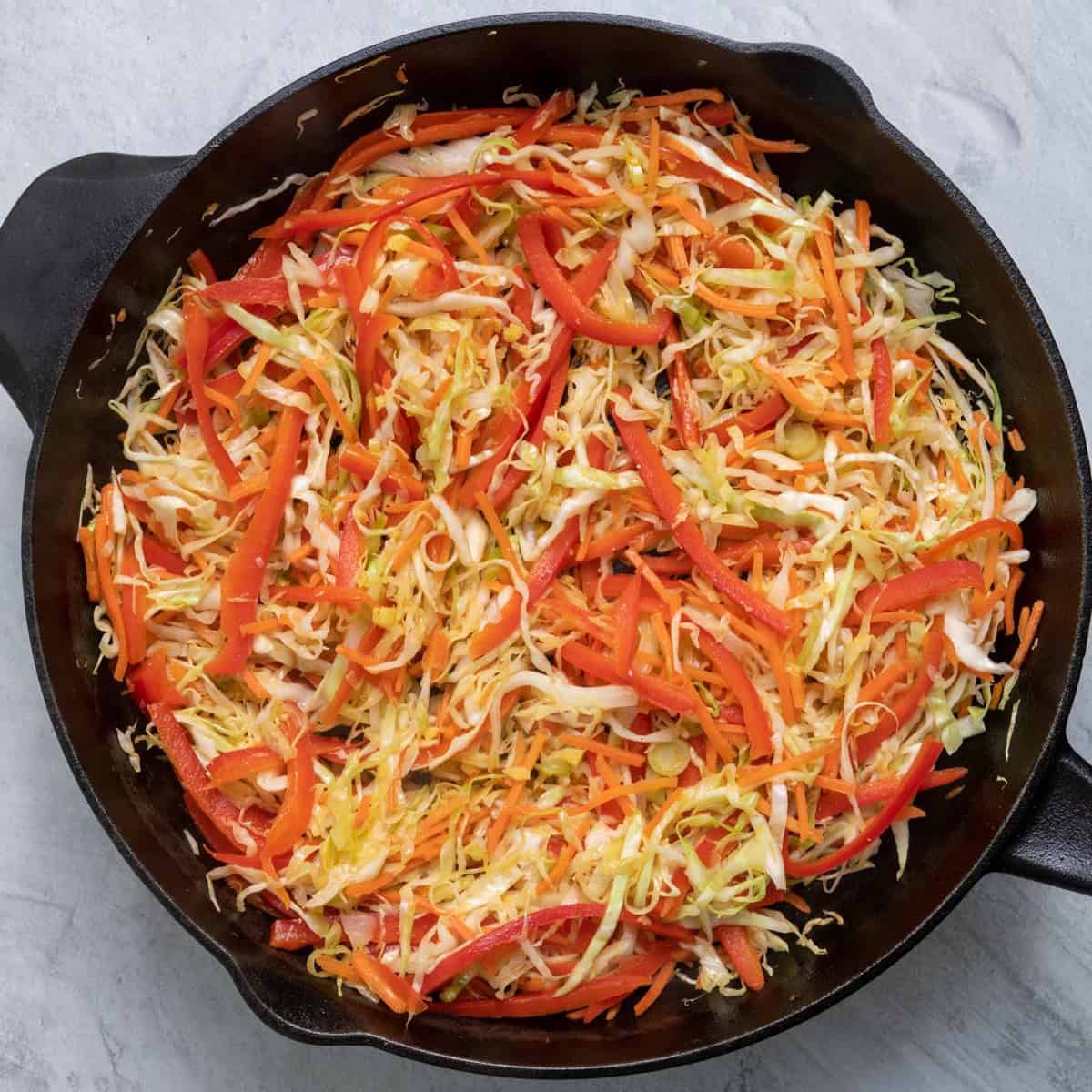 Cooked cabbage, pepper, carrots and onions.