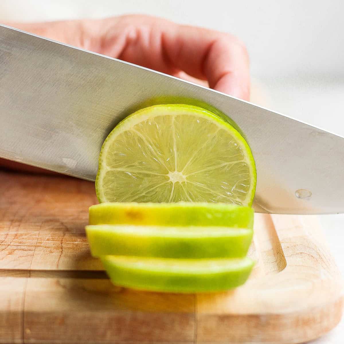 Knife continuing to cut more slices.