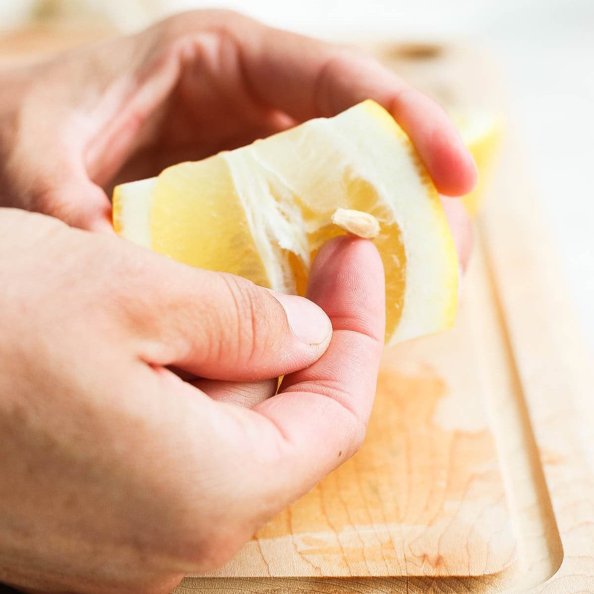 Finger removing seeds.