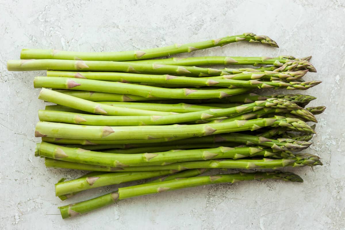 Bunch of asparagus on a white board