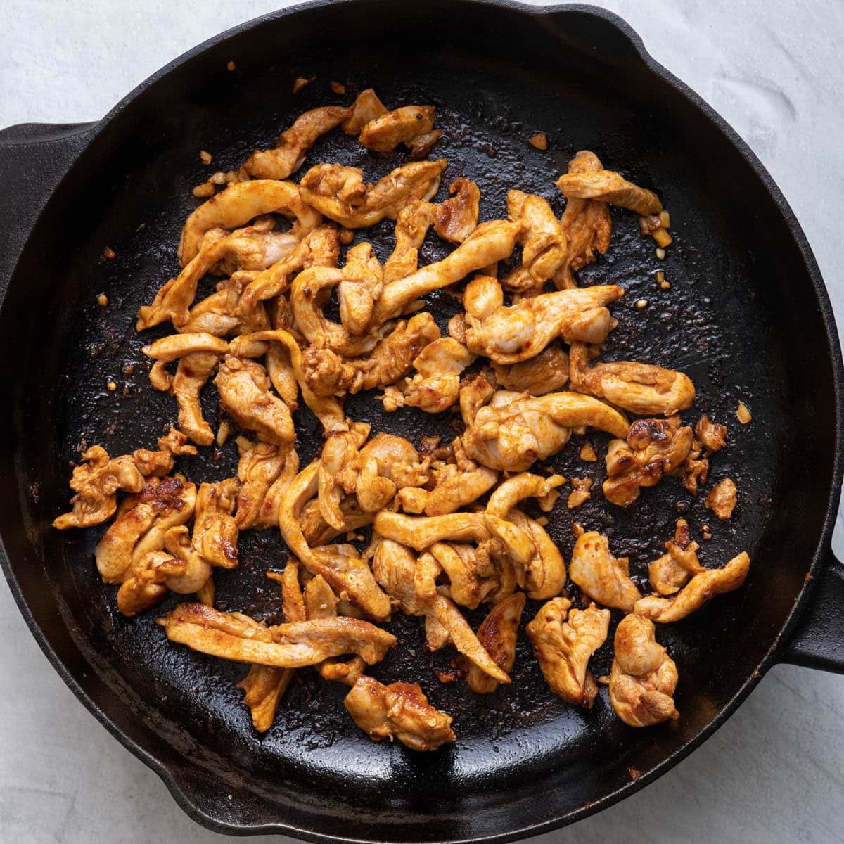 Chicken on a pan after fully cooked.