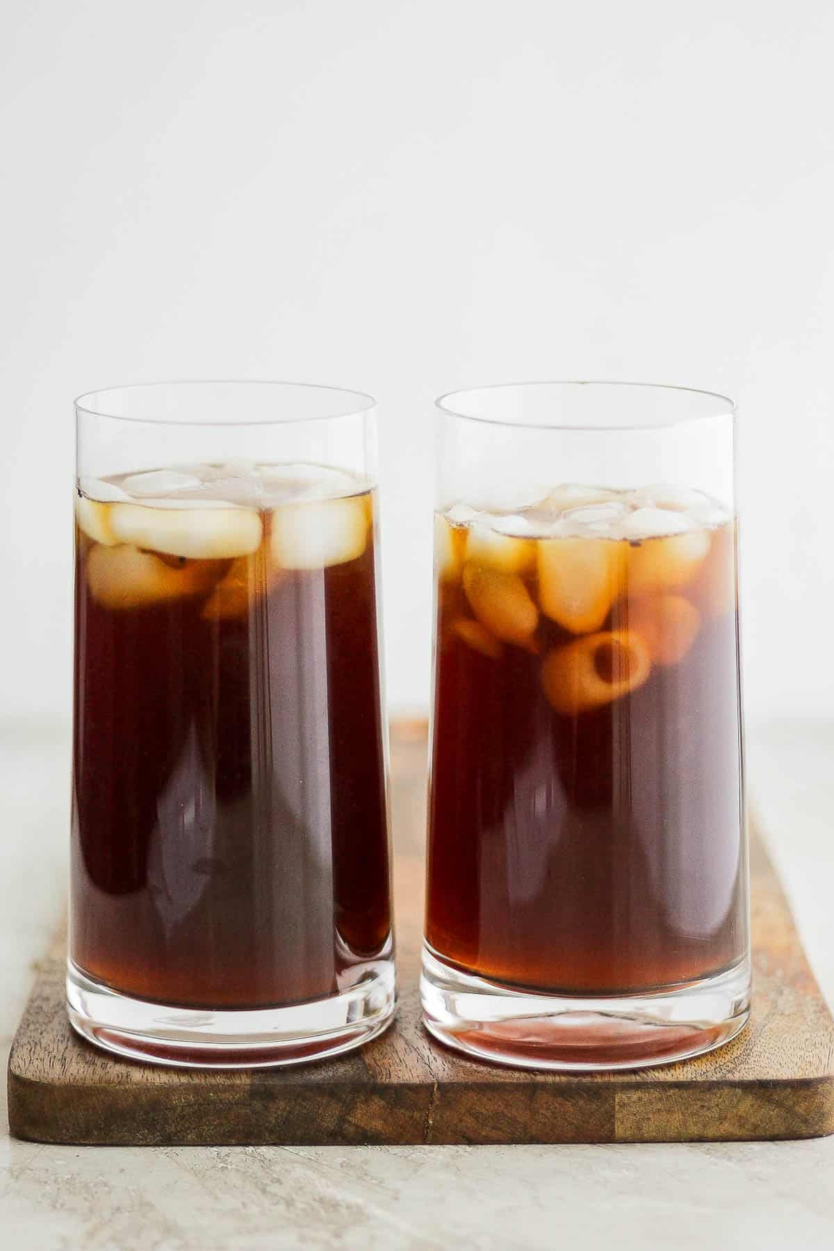 2 tall glasses of cold brew coffee served with ice