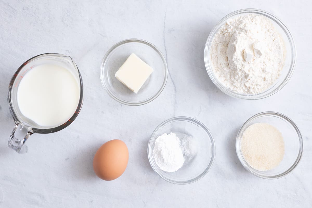 Ingredients for recipe: milk, egg, butter, salt, baking powder, sugar, and flour.