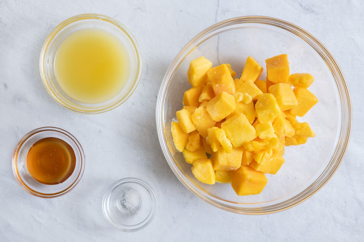 Ingredients for mango popsicle recipe.