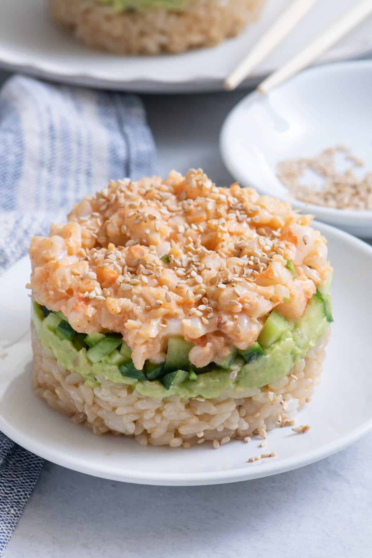 Sushi shrimp stack made with spicy mayo shrimp, avocado, cucumbers and rice