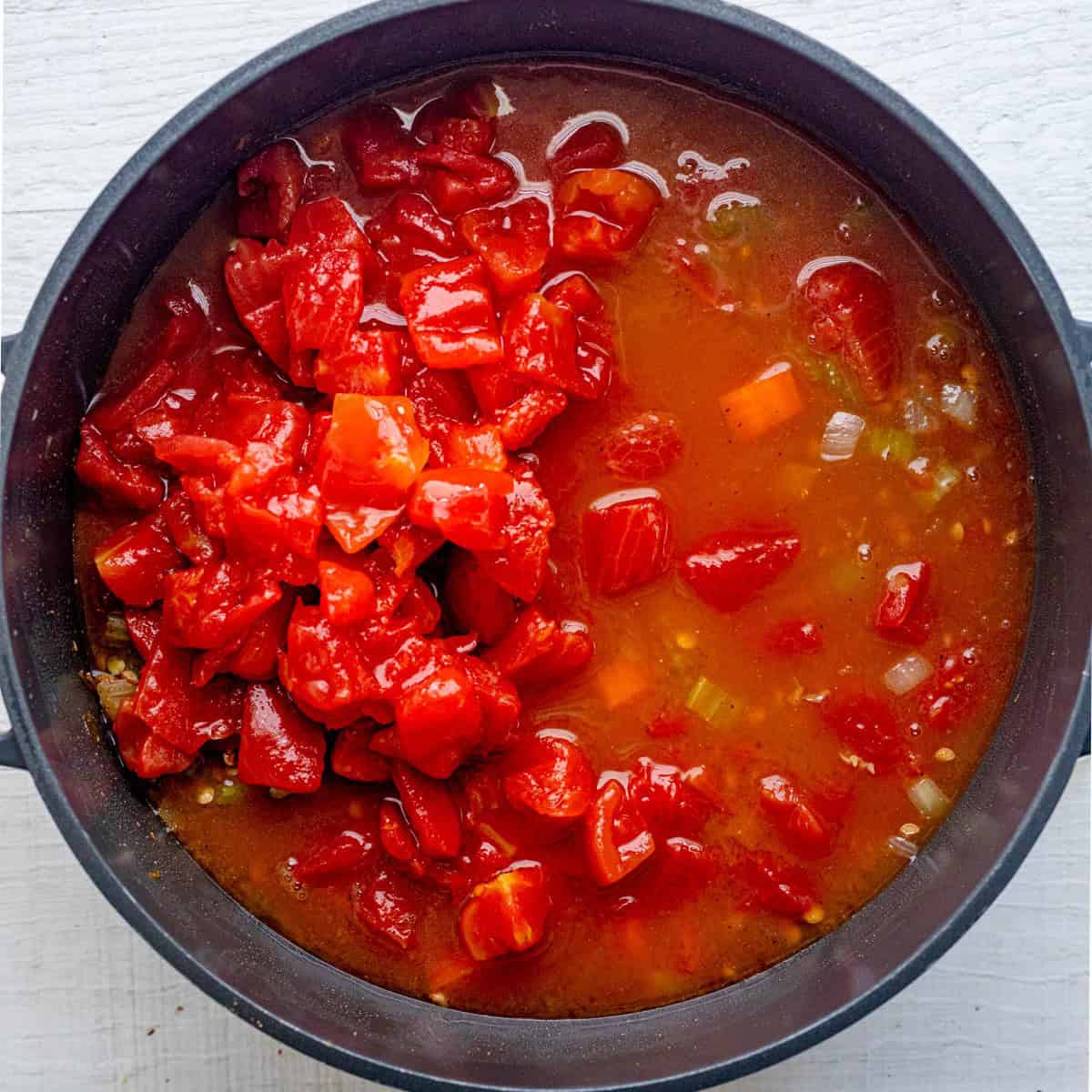 Tomatoes and broth added.