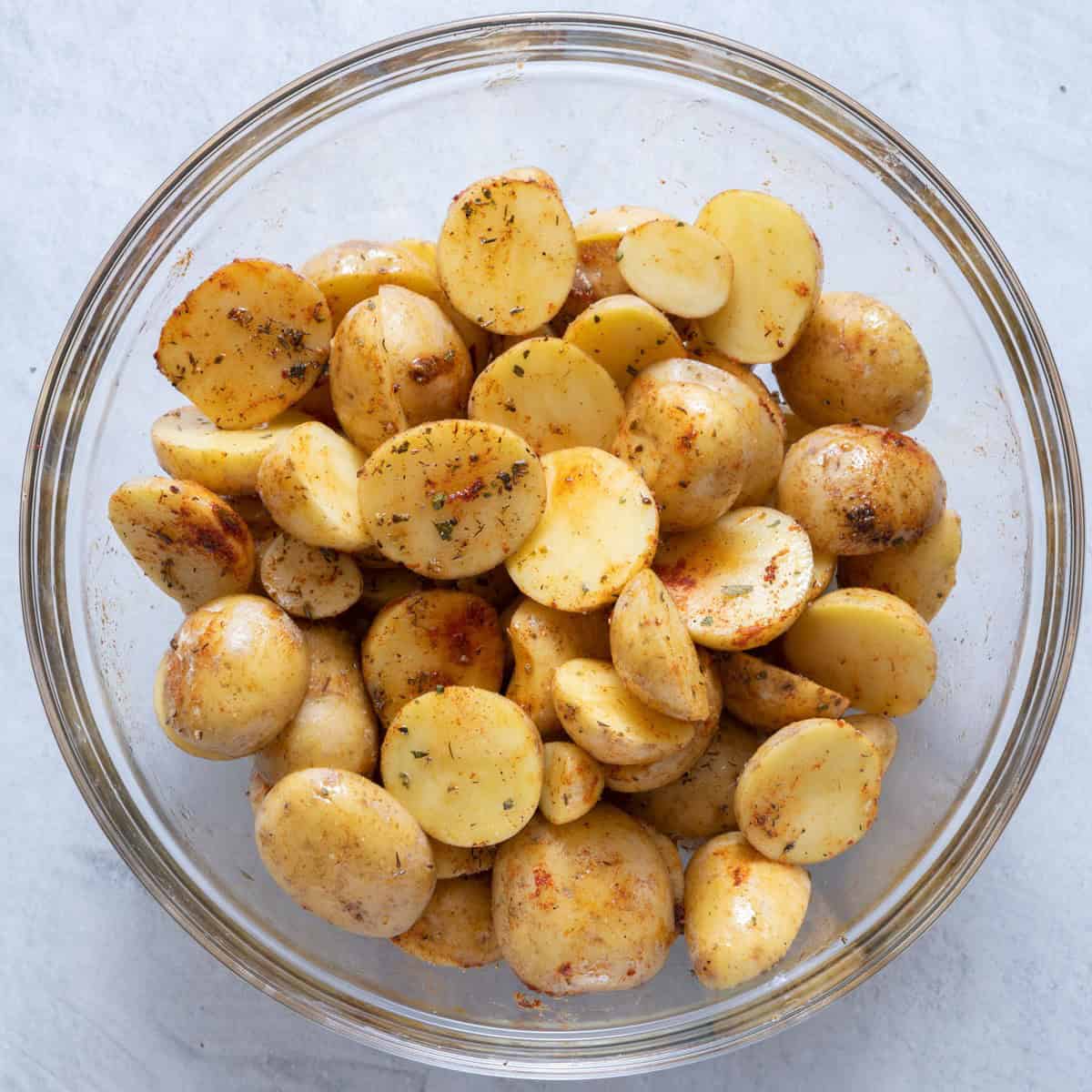 Potatoes tossed with oil and seasoning.