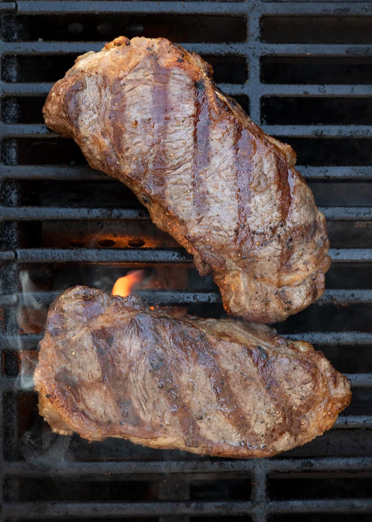 Final cooked steak on grill.