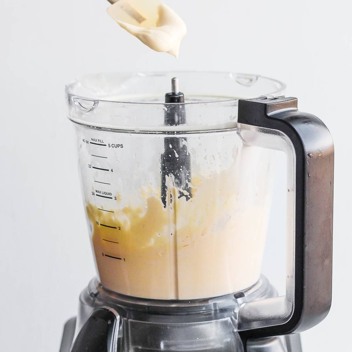 Final mayo in food processor, maybe with spatula scooping it.