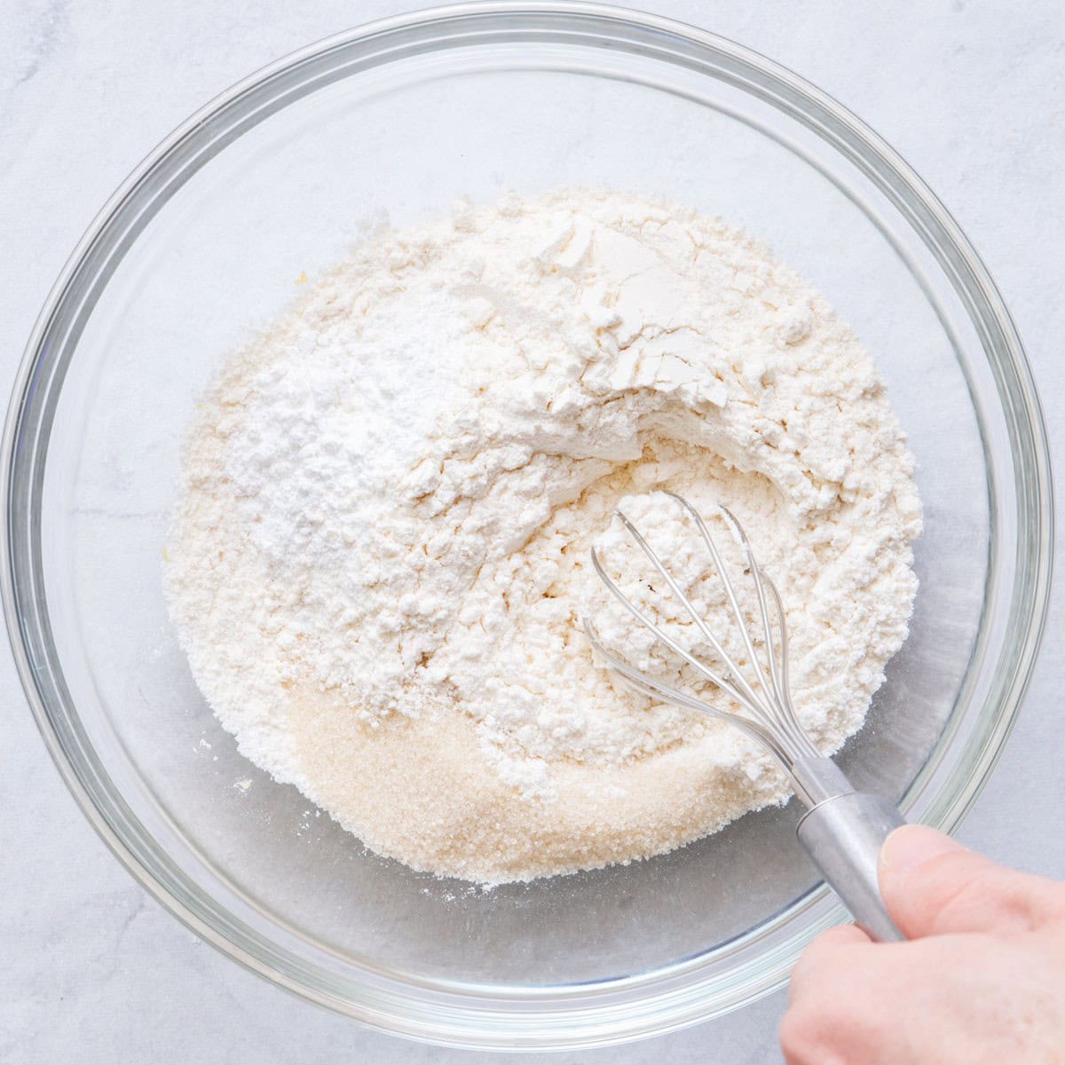 Whisking flour, brown sugar, baking powder and salt before mixing.