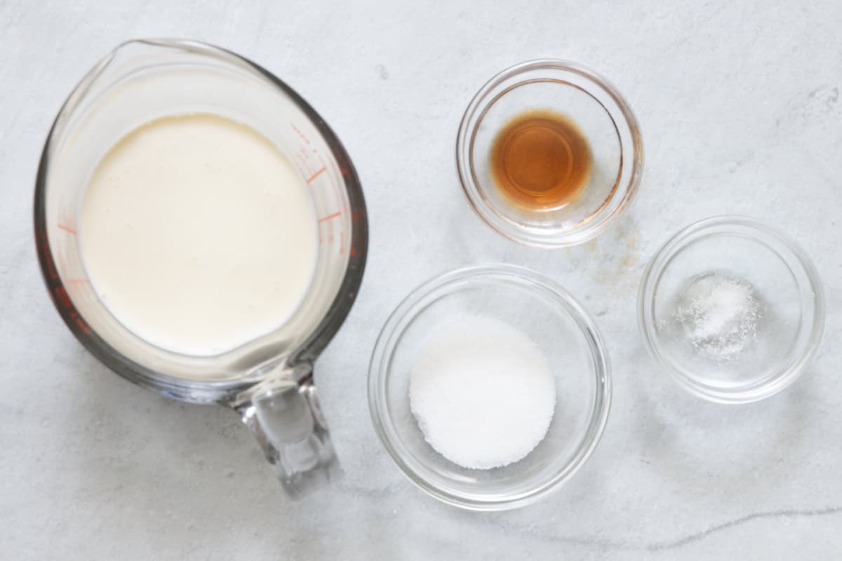 Ingredients for recipe in individual bowls and cup.