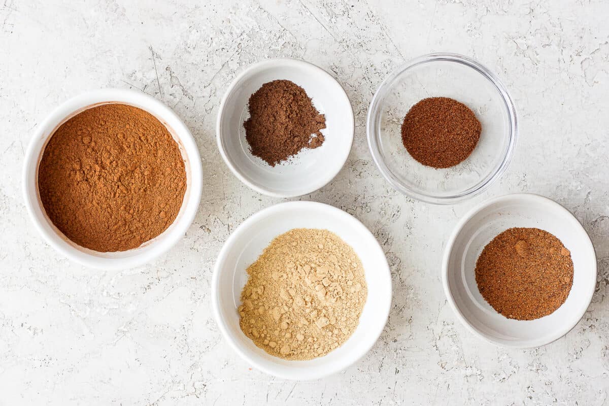 Ingredients for spice recipe in individual bowls.