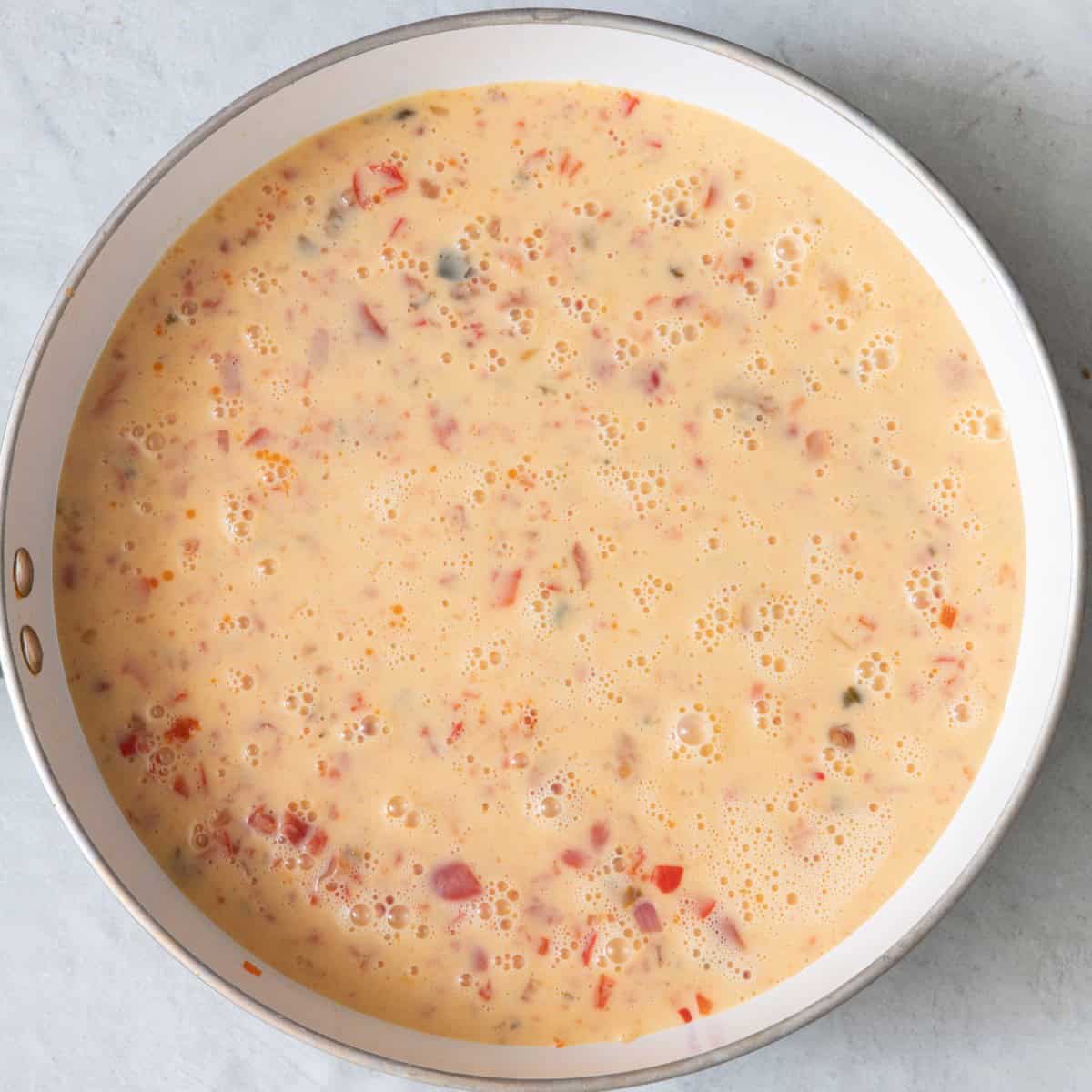 Egg mixture added on top of veggies.
