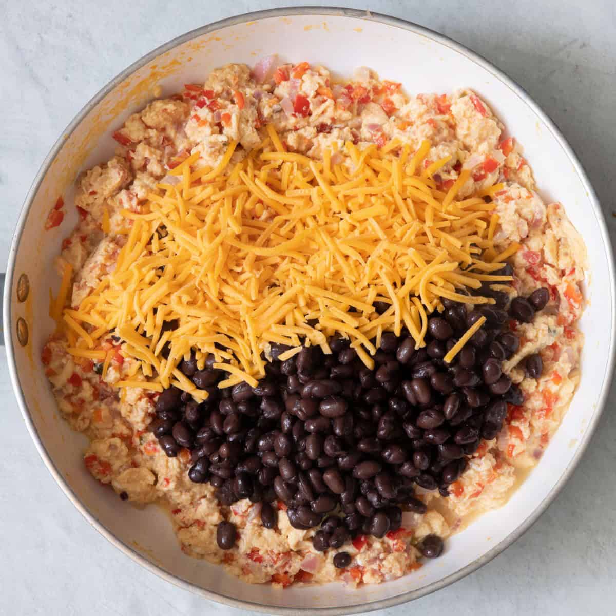 Cheddar cheese and black beans added.