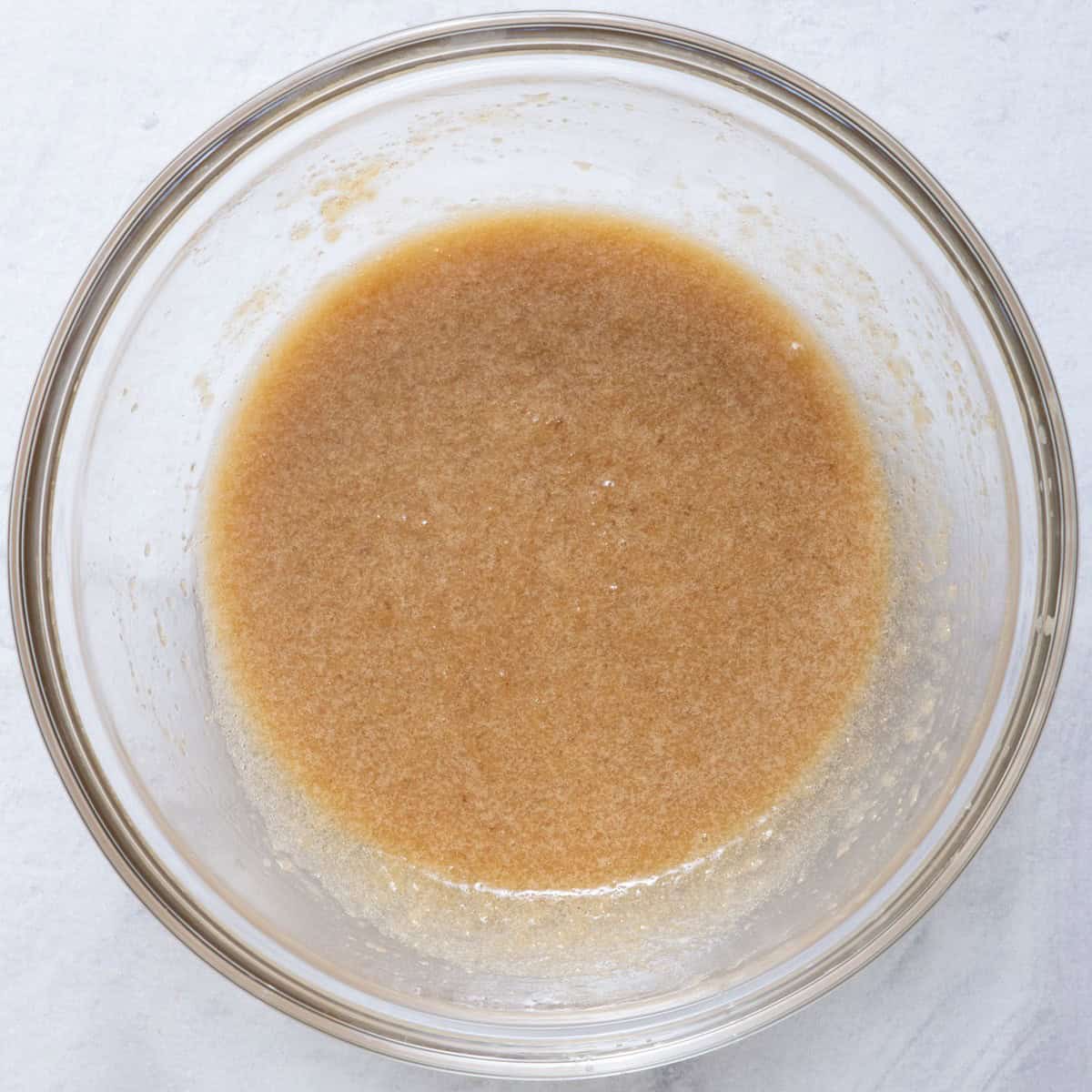 Sugar, melted butter, applesauce and vanilla whisked together.