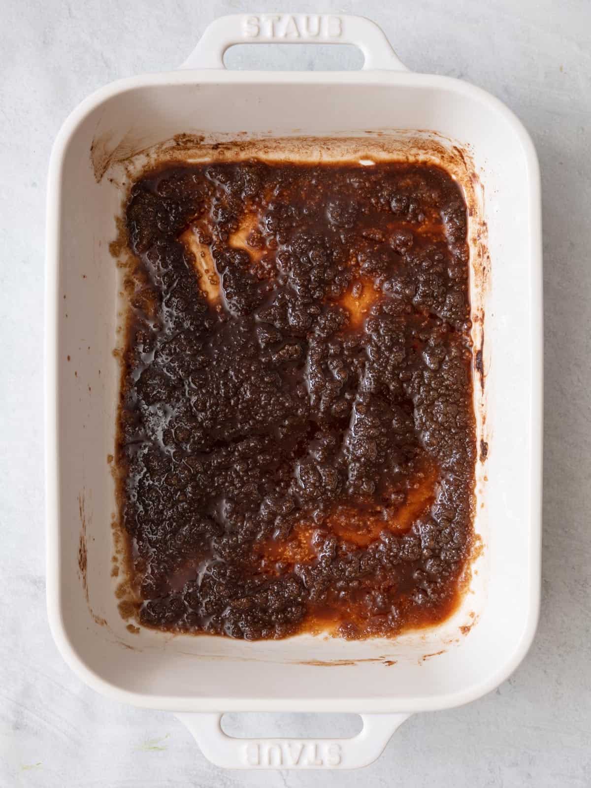 Butter tossed with brown sugar, cinnamon, ginger and salt in baking dish.
