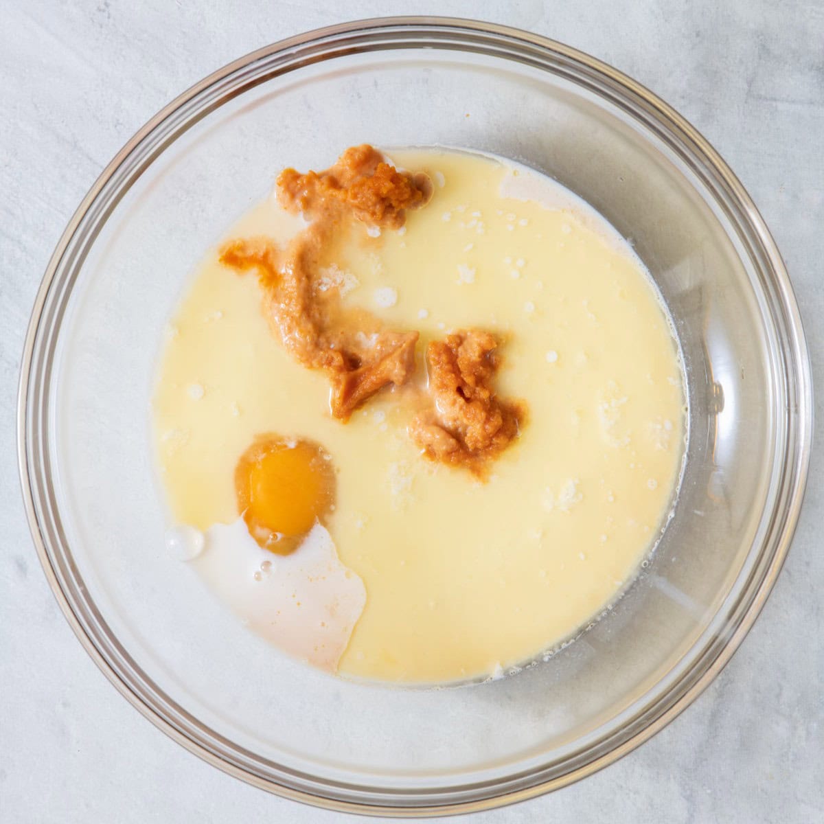 Milk, pumpkin puree, egg, maple syrup, butter and vanilla before mixing.