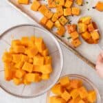 Cooked butternut squash cubes cooked three ways: roasted on a baking sheet, boiled in a strainer, and microwaved in a bowl.