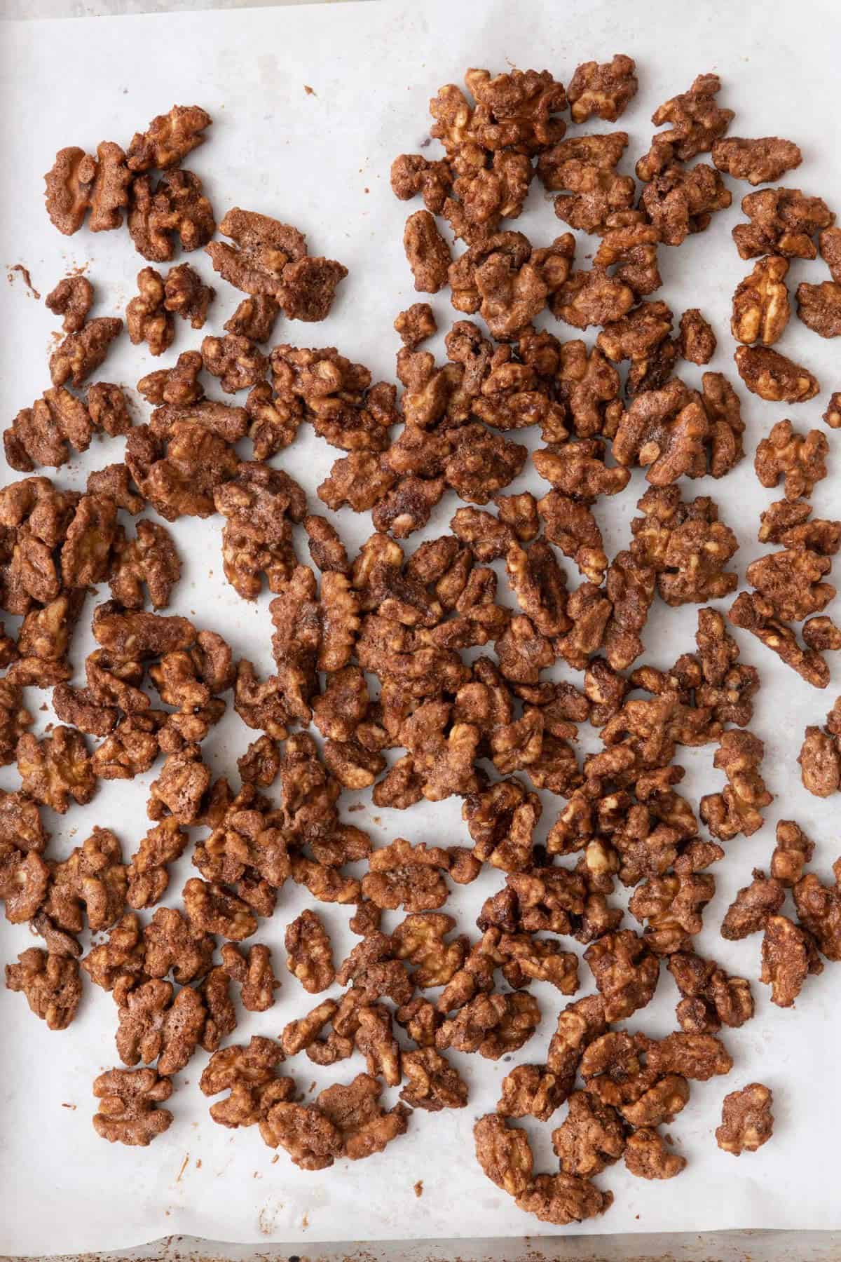 Walnuts on baking sheet after being after baked.