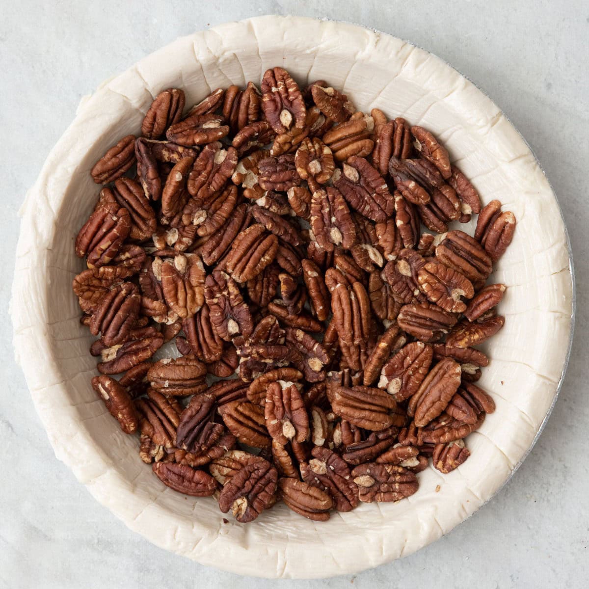 Toasted pecans added to pie crust.