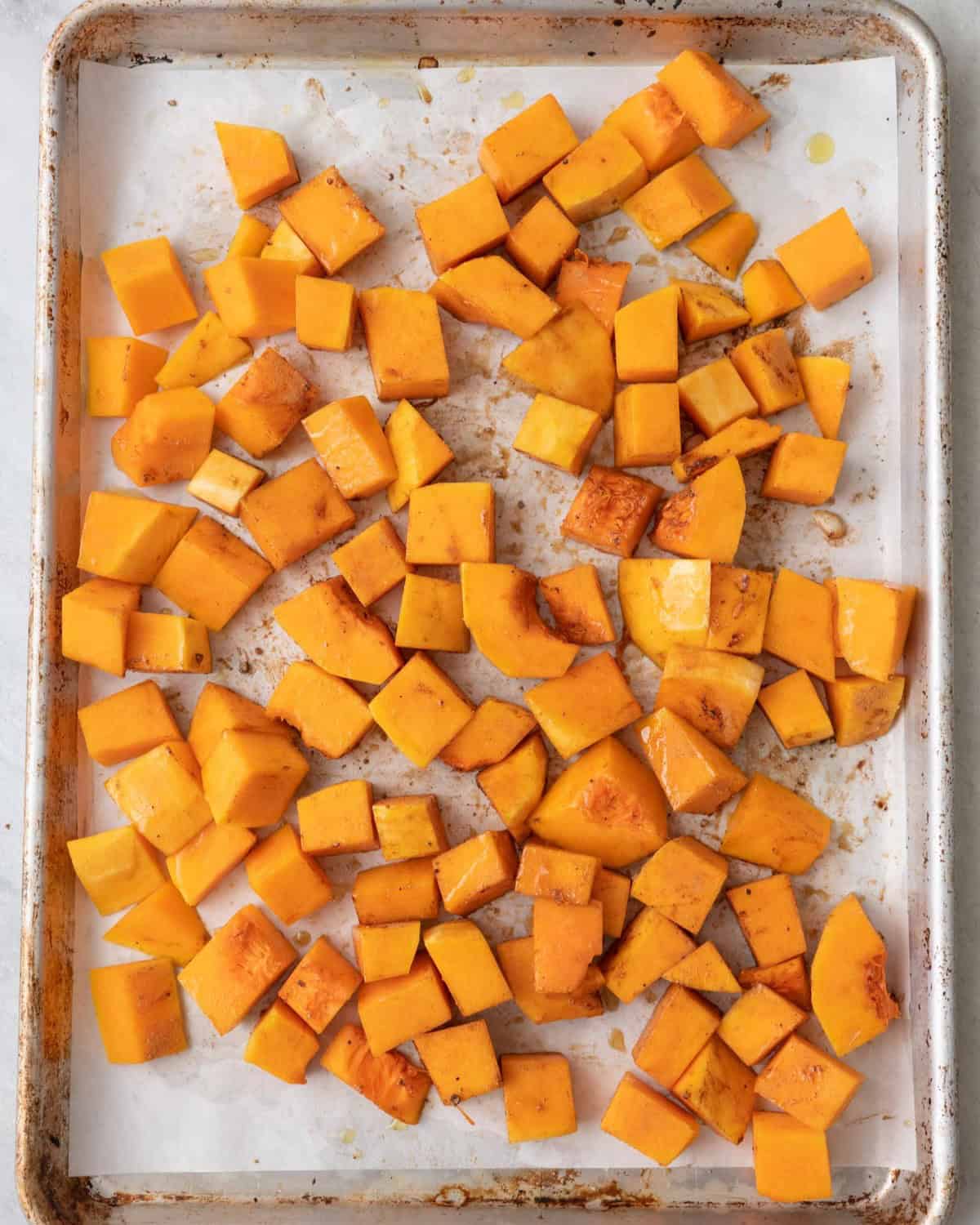 Butternut squash on baking sheet before baking.
