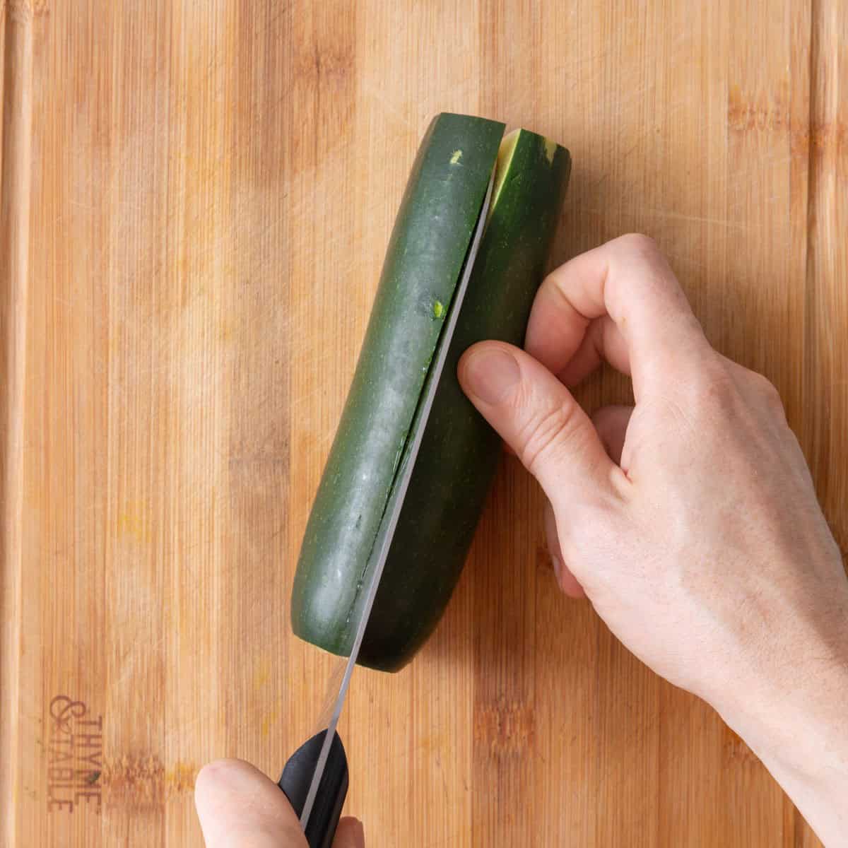Cut zucchini in half lengthwise.