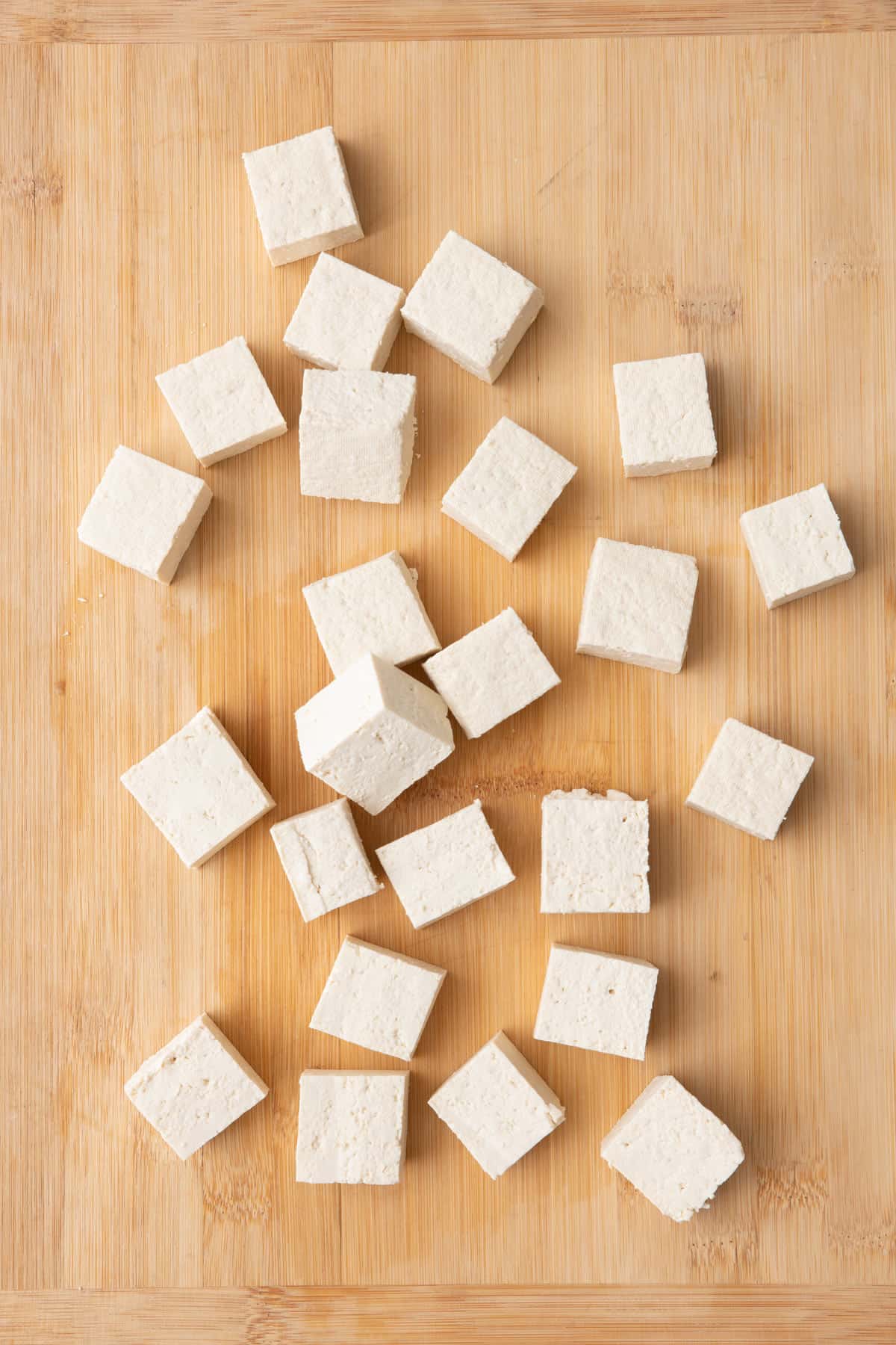 Pressed tofu cut into large cubes.