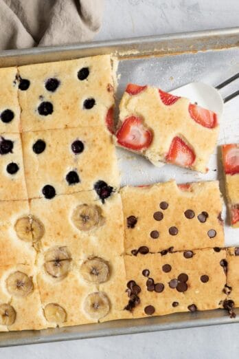 Pancakes made in a sheet pan cut into 12 squares with four different toppings
