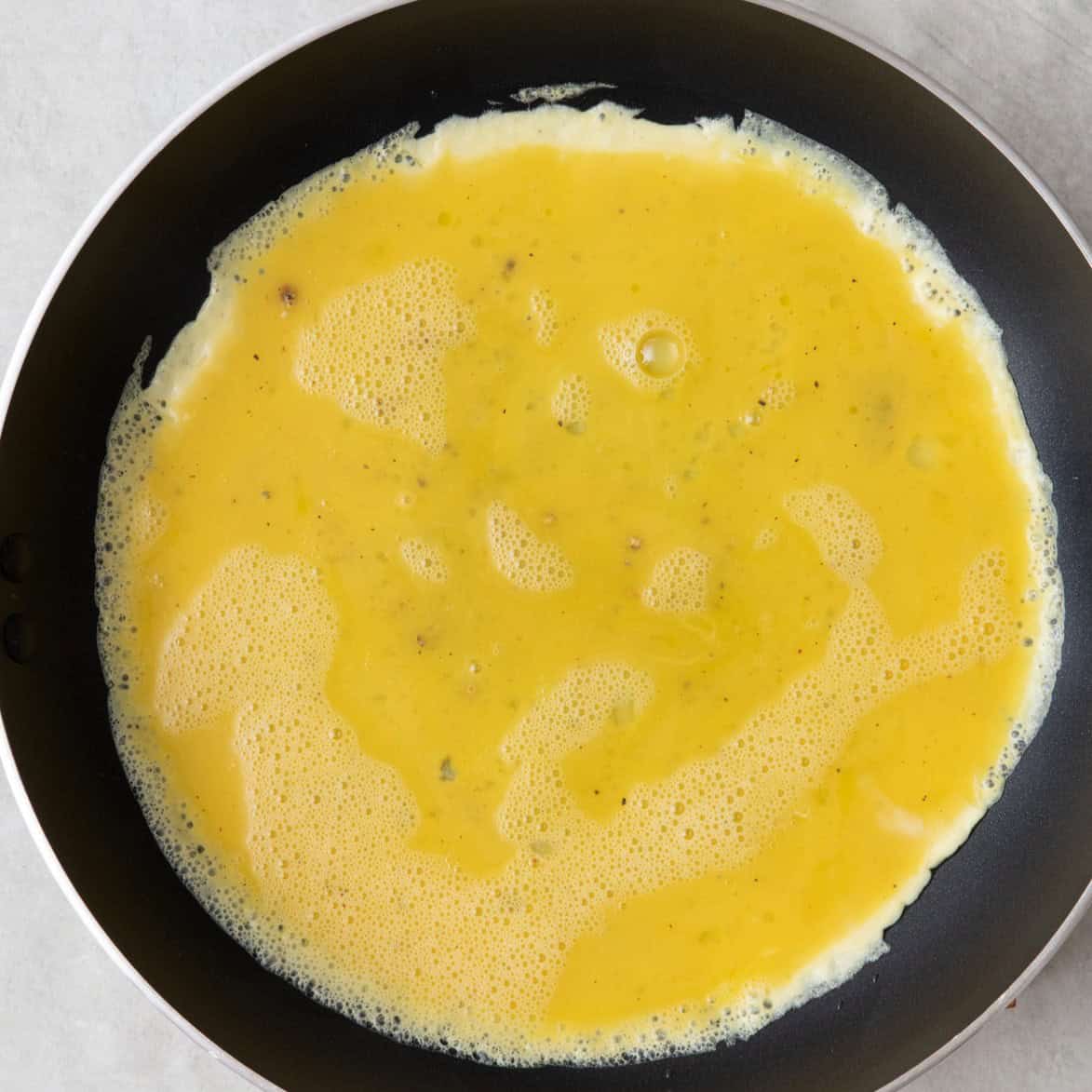 Contents in a pan, halfway cooked.