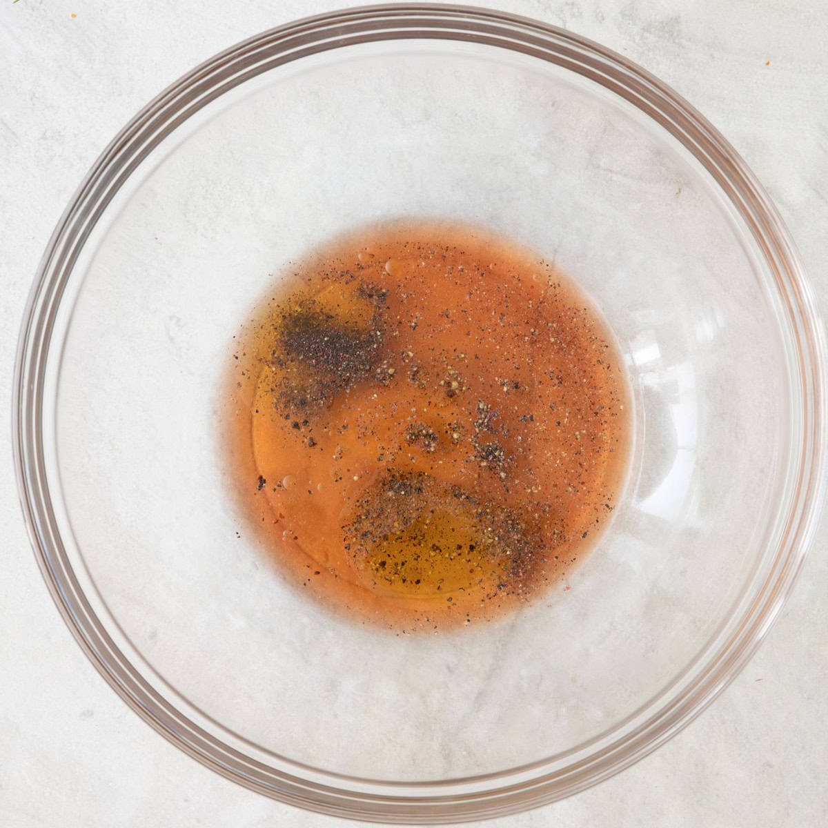 Dressing ingredients in bowl before mixed.