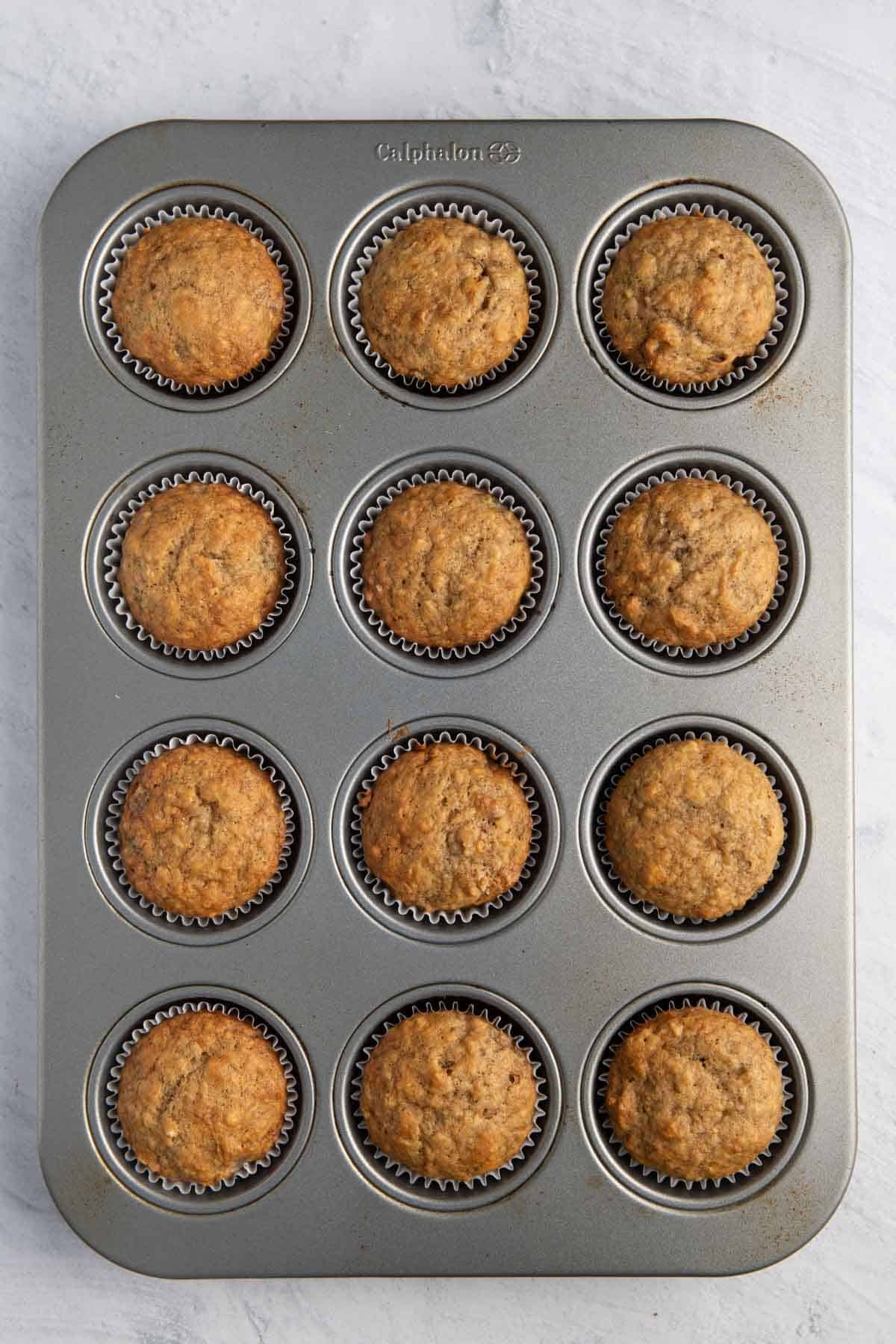 Muffins in muffin tin after baking.