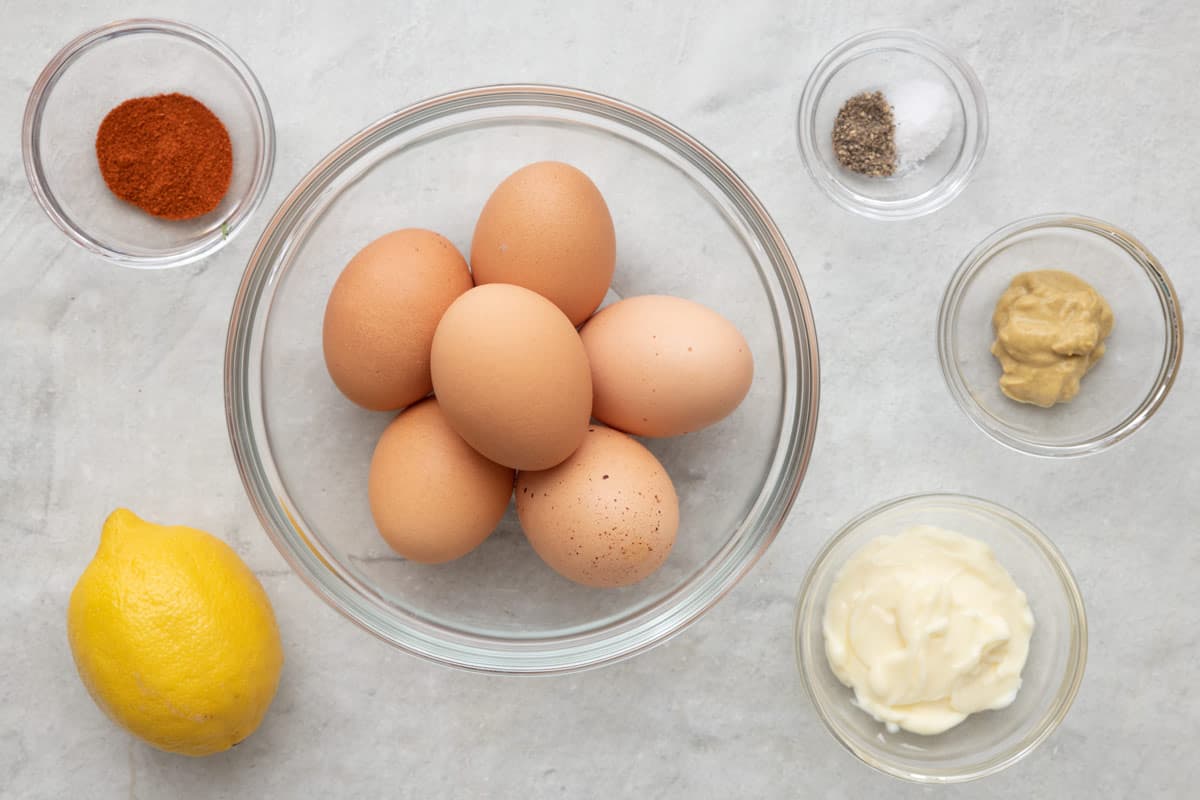 Ingredients for recipe: paprika, lemon, 6 brown eggs, salt and pepper, dijon mustard, and mayonnaise.