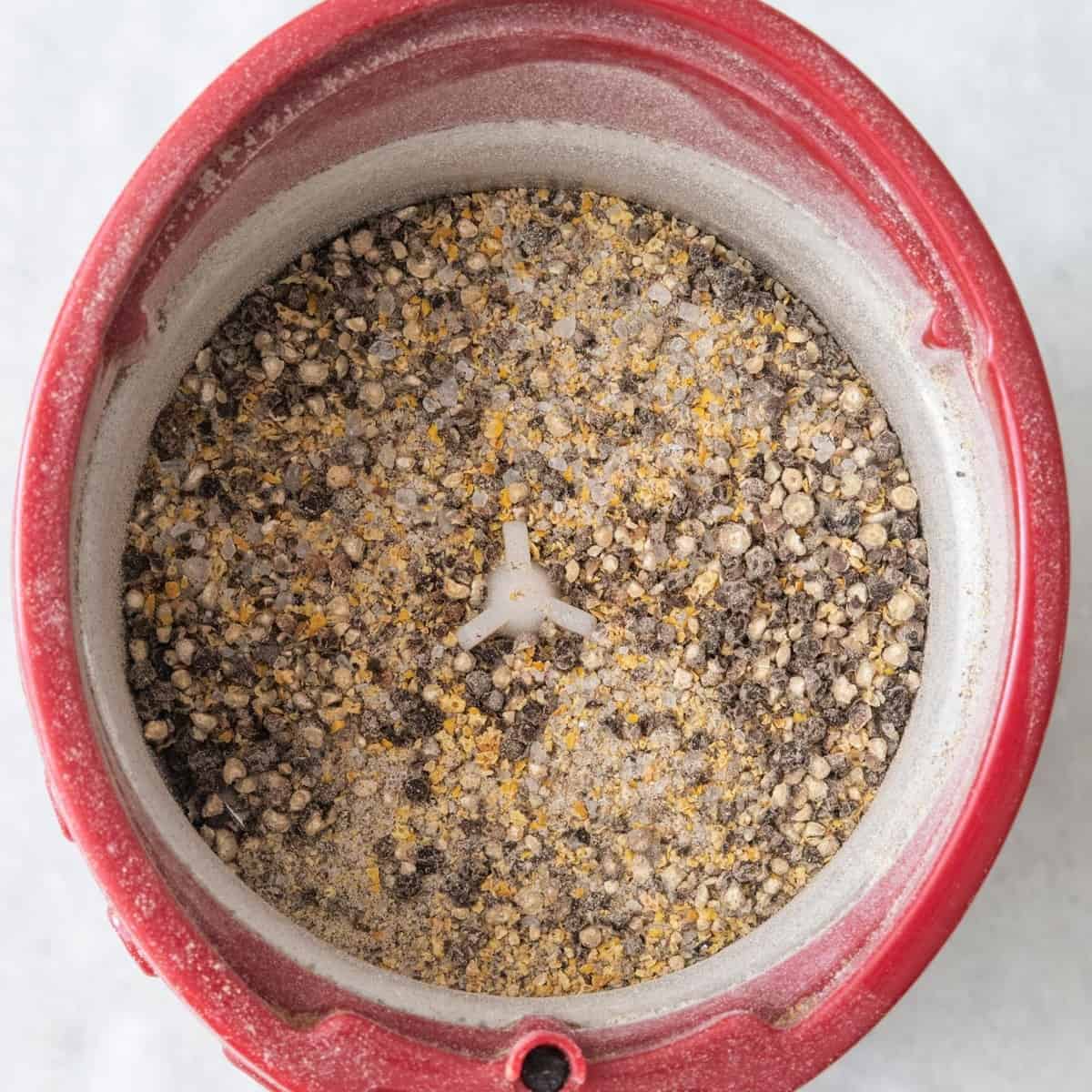 Lemon pepper after grinding to show a slightly coarse texture.