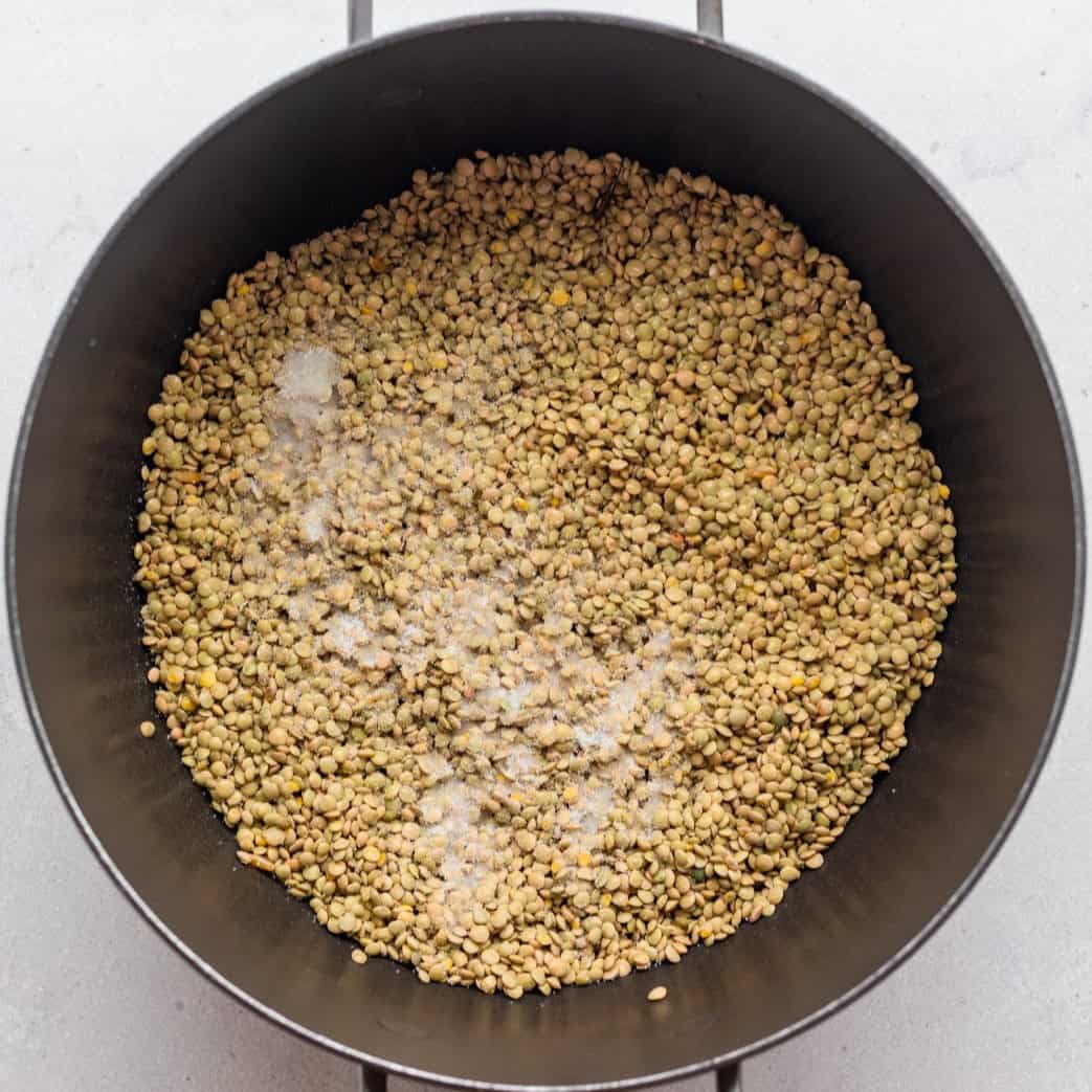 Lentils in a pot with salt.
