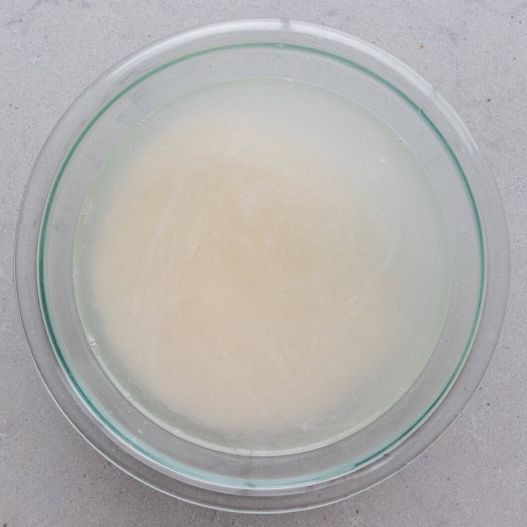 Rice in a bowl full of water.