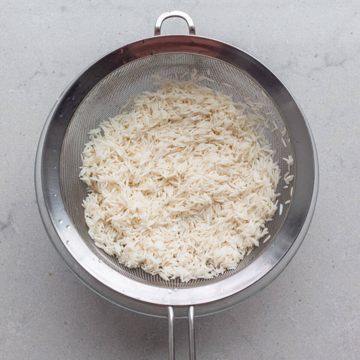 Rice in a strainer.
