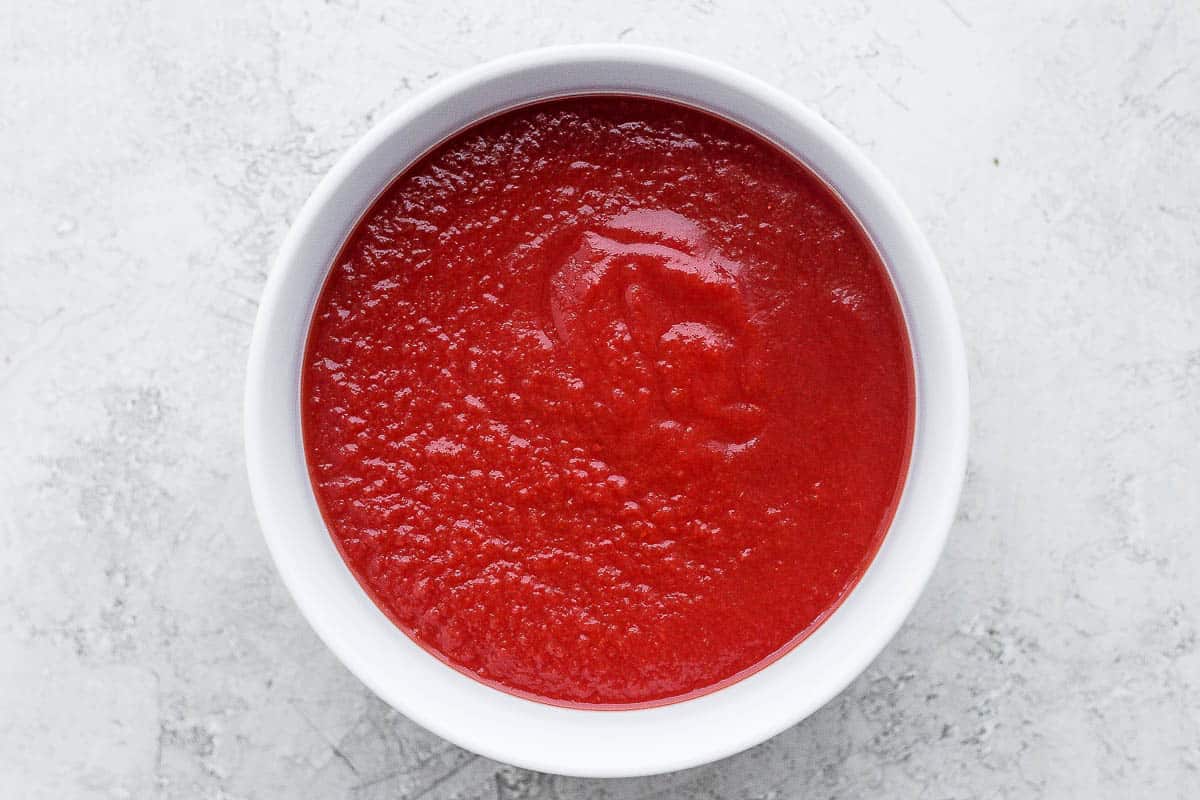 Canned tomato sauce in a bowl.