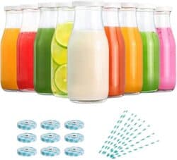 Set of 9 11 ounce glass milk bottles with lids and straws.
