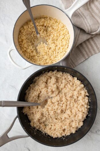 Two pots of different sized bulgur after fluffing with a spoon dipped into each.