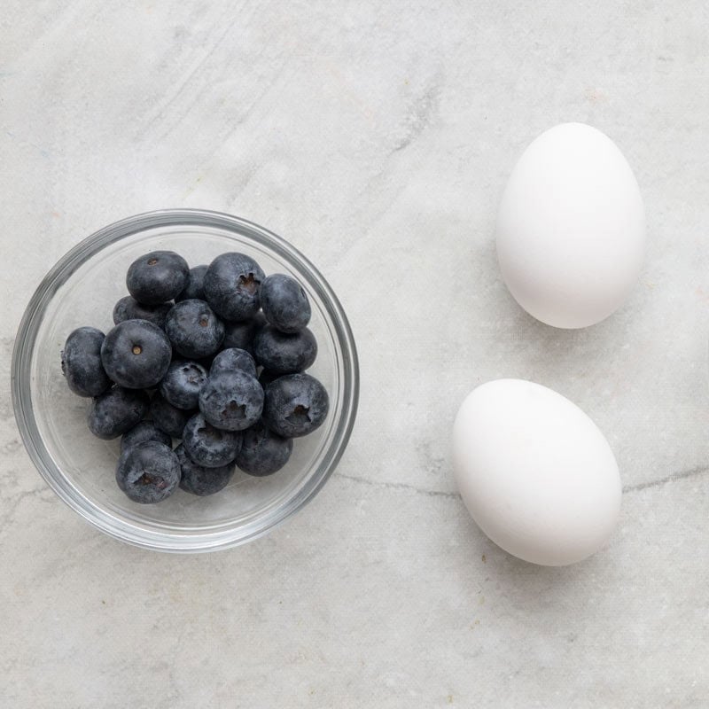 Ingredients to make light blue dyed eggs.