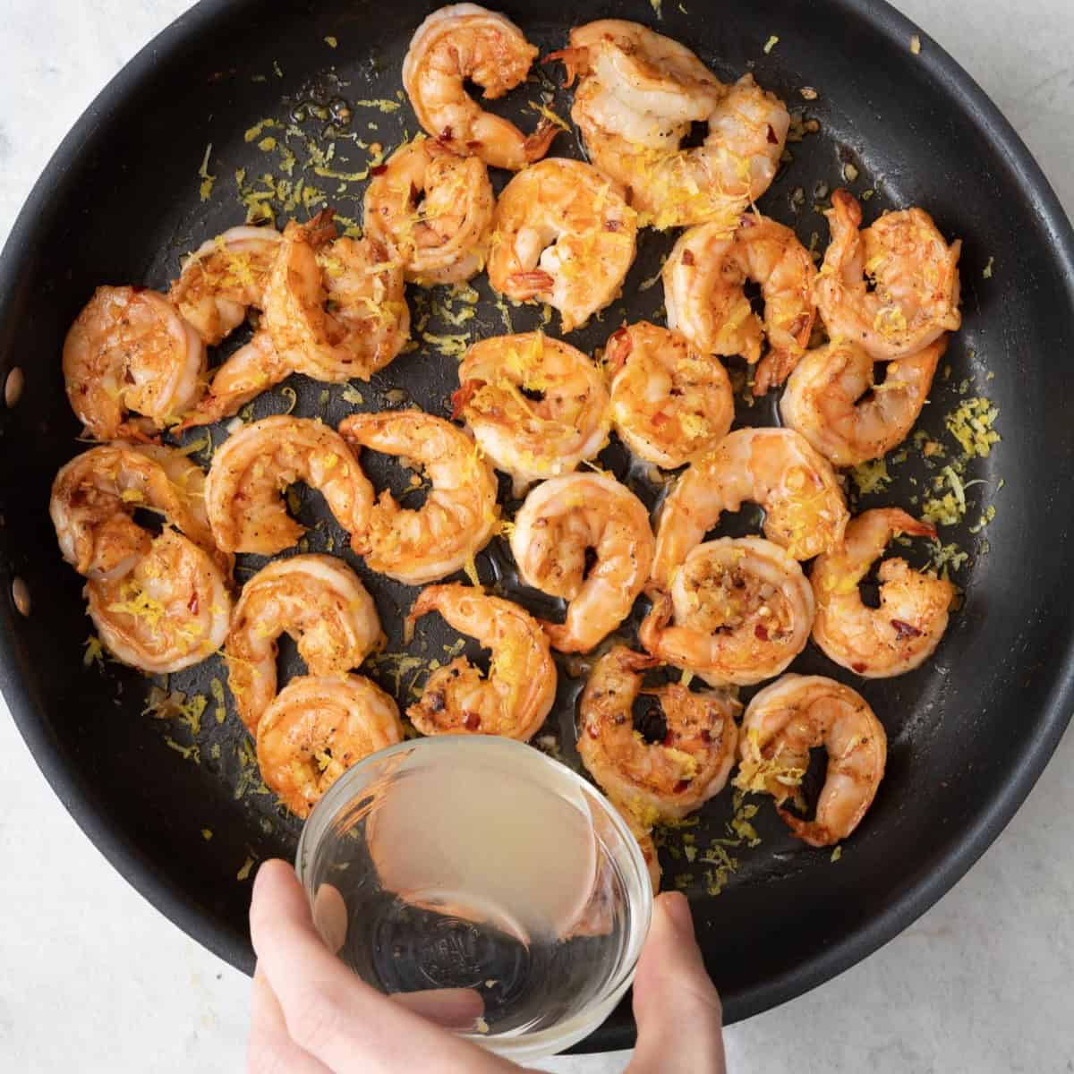 Shrimp tossed in sauce.